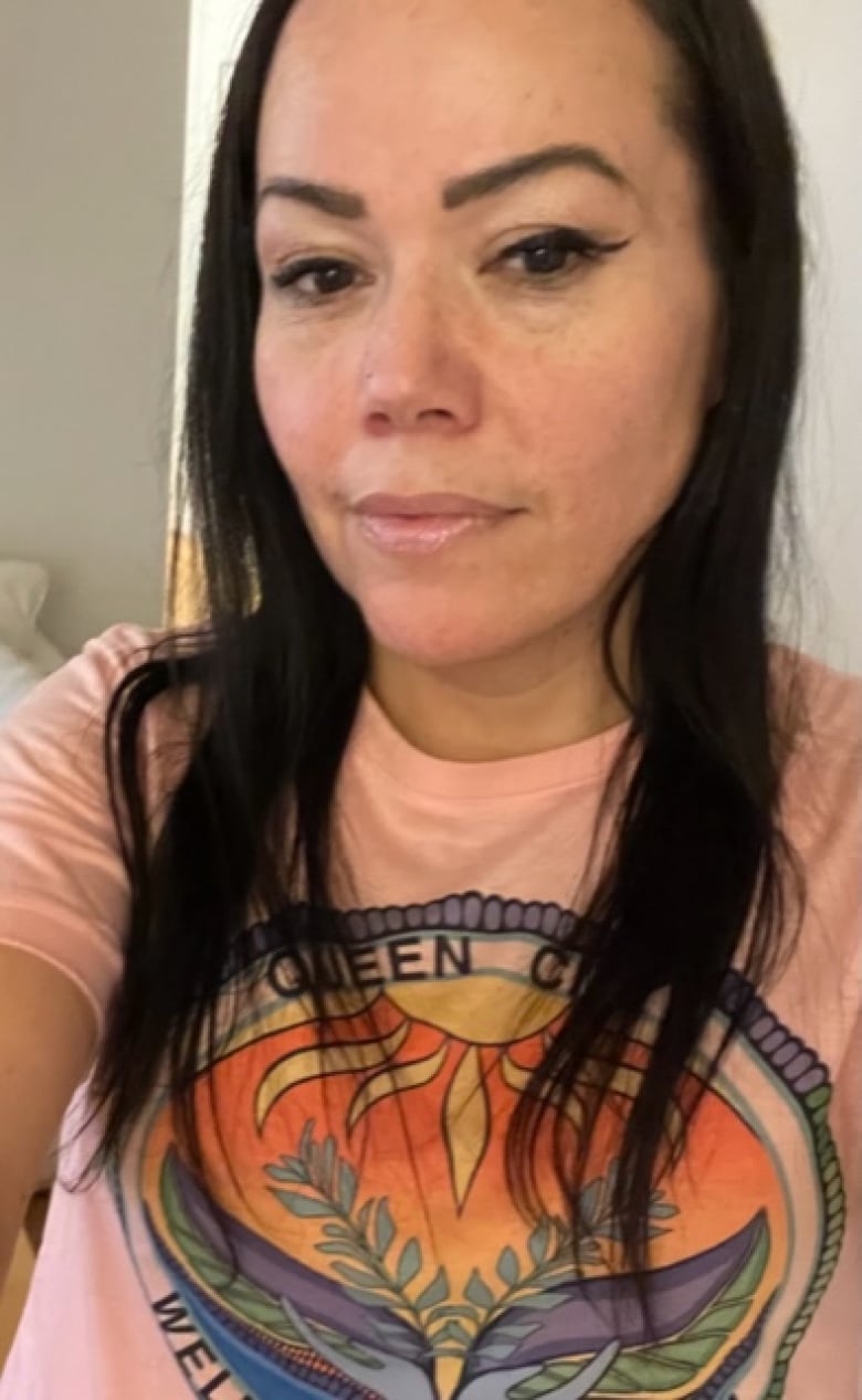 A selfie of an Indigenous woman with long dark hair. 