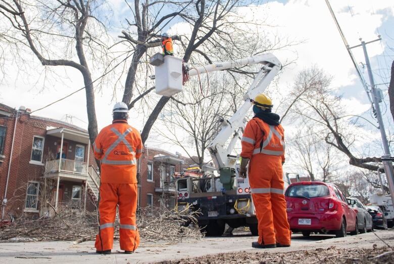 A Hydro-Qubec crew works on a power line following an ice storm in Montreal.