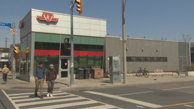 A TTC station is seen from across the street.