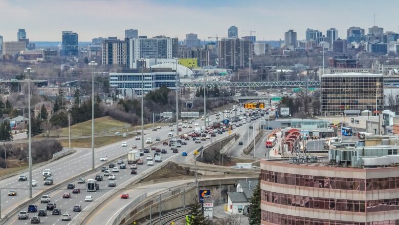 A photo from above of a highway leading into a city.