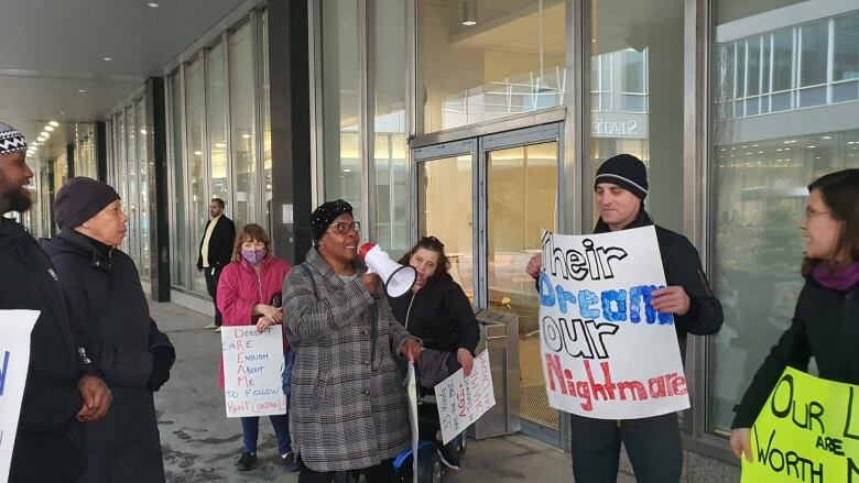 Beverley Henry with fellow tenants at a rally.