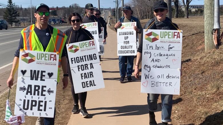 UPEFA memebrs walk the picket line along Uiversity Avenue.