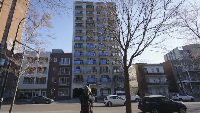 large building with pro-tenant banners on the balconies