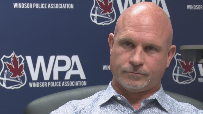 Kent Rice sitting in front of a union backdrop.