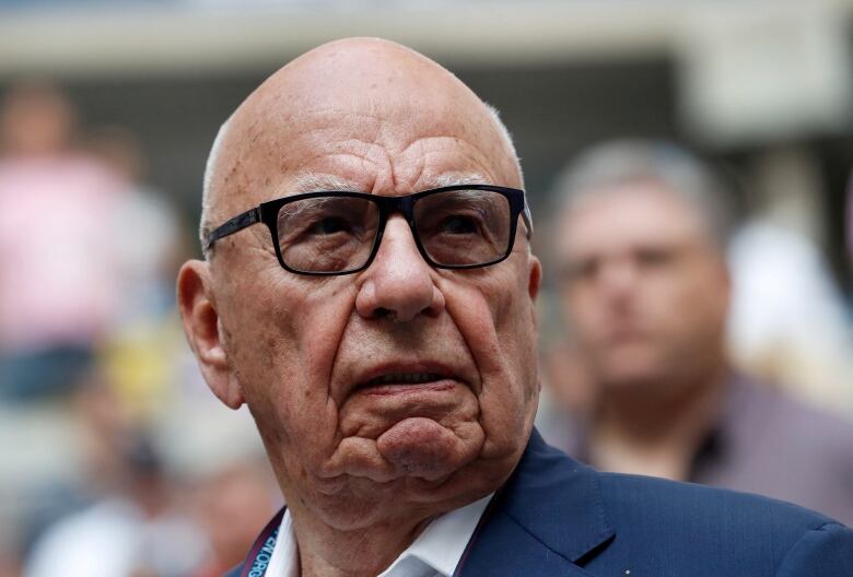 Rupert Murdoch, Chairman of Fox News Channel stands before Rafael Nadal of Spain plays against Kevin Anderson of South Africa. 