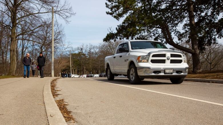 Cars driving through High Park on March 24, 2023.