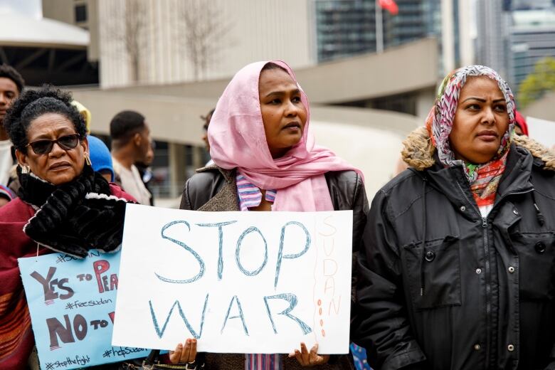 Supporters and members of Torontos Sudanese community hold a rally to oppose fighting in Sudan at Nathan Phillips Square in Toronto on April 23, 2023.