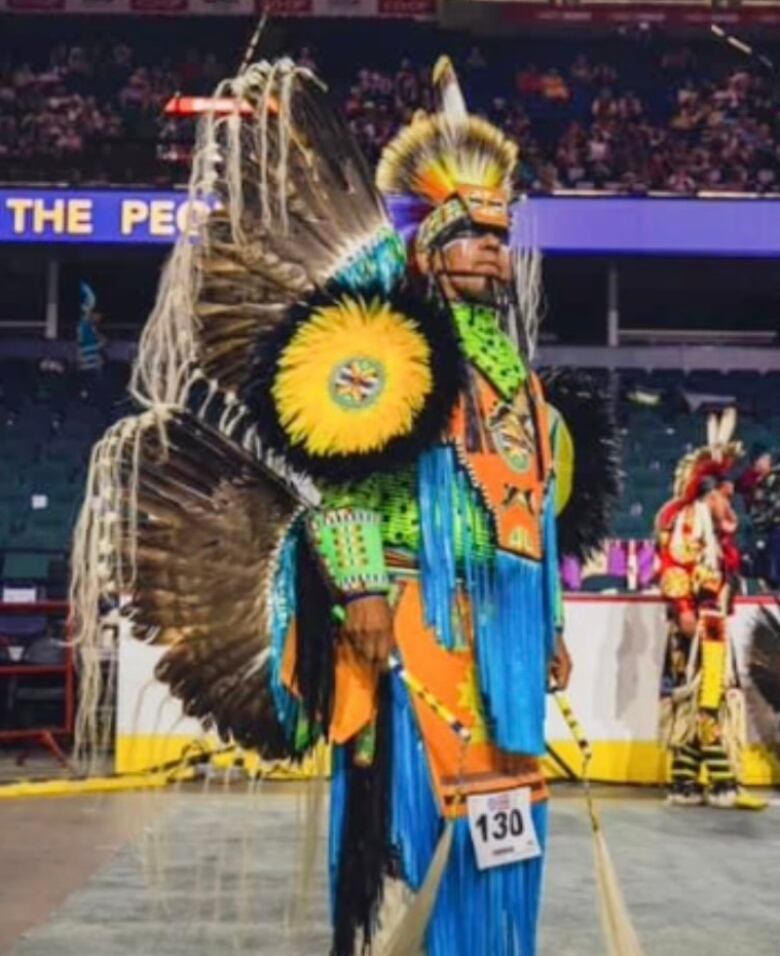 Rawn Belanger in his fancy dance regalia at a powwow