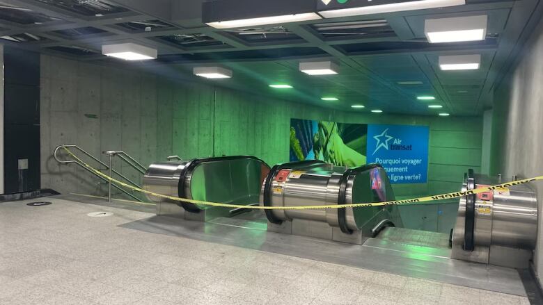 Caution tape over Berri-UQAM Metro escalators 