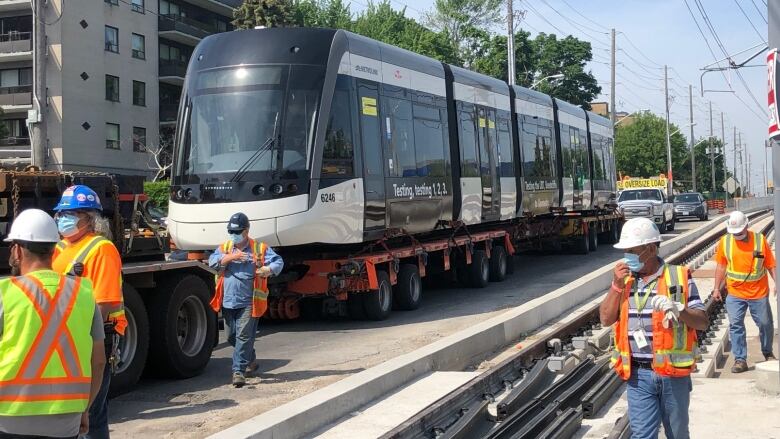 A test train for the Eglinton Crosstown LRT is loaded onto the tracks.