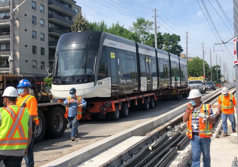 A test train for the Eglinton Crosstown LRT is loaded onto the tracks.