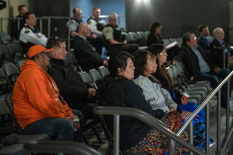 Attendees sit in Mefort listening to RCMP provide a preliminary timeline presentation of the James Smith Cree Nation and Weldon mass casualty homicides which occurred on Sept. 4, 2022. 