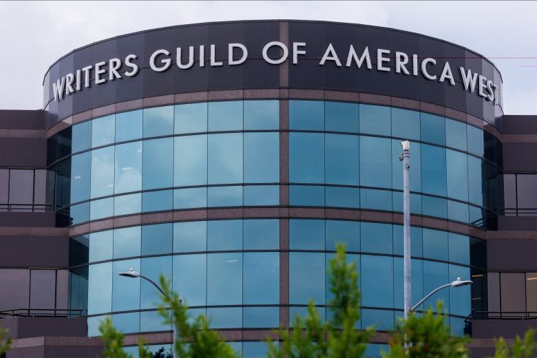 A building exterior is shown bearing the words Writers Guild of America West.