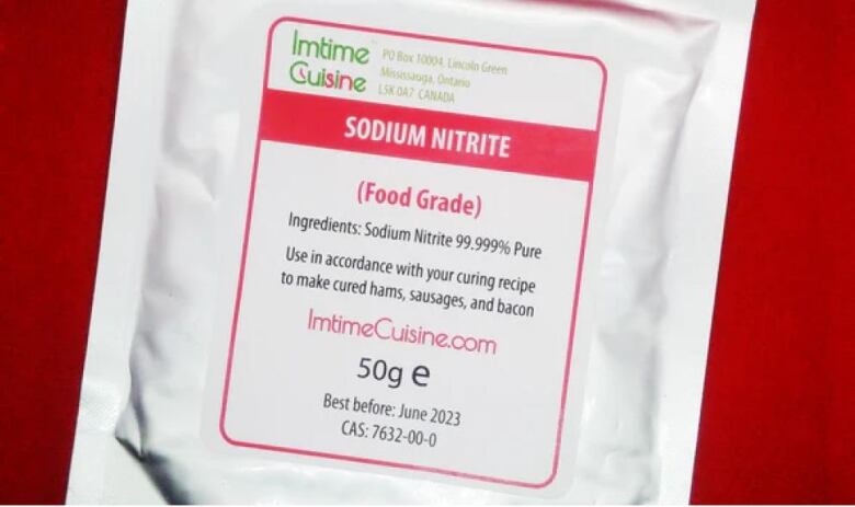 A closeup of a white plastic package. The label reads in part 'Imtime Cuisine... sodium nitrate.'