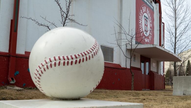 A baseball sculpture outside Port Arthur Stadium.