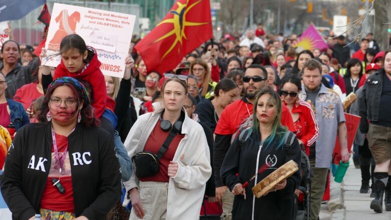 People march on the streets of Winnipeg.