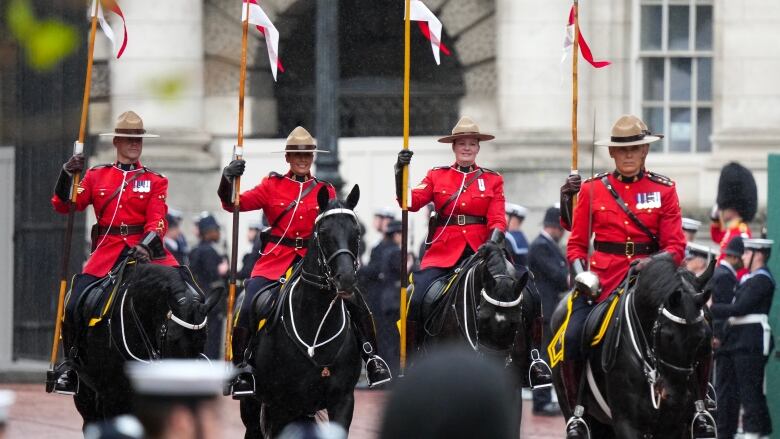 RCMP officers are pictured in London during the coronation royal procession.