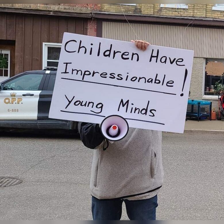 Person holding a sign