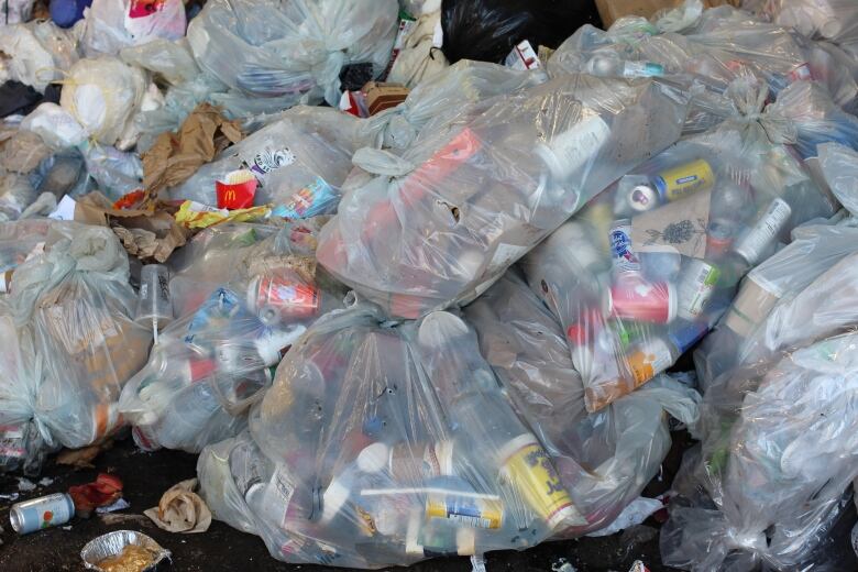 Bags of garbage are pictured at the tipping floor at the Banff waste transfer station.