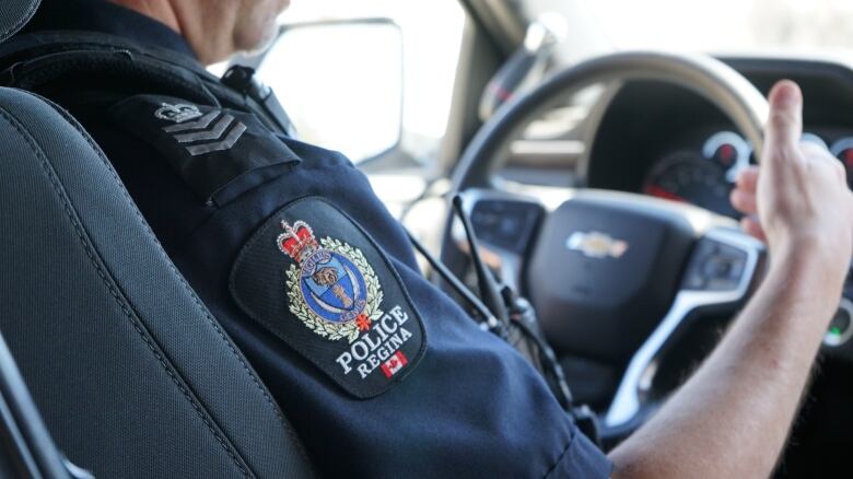 Sgt. Josh Potter of the Regina Police Service drives through city streets in a police vehicle. 