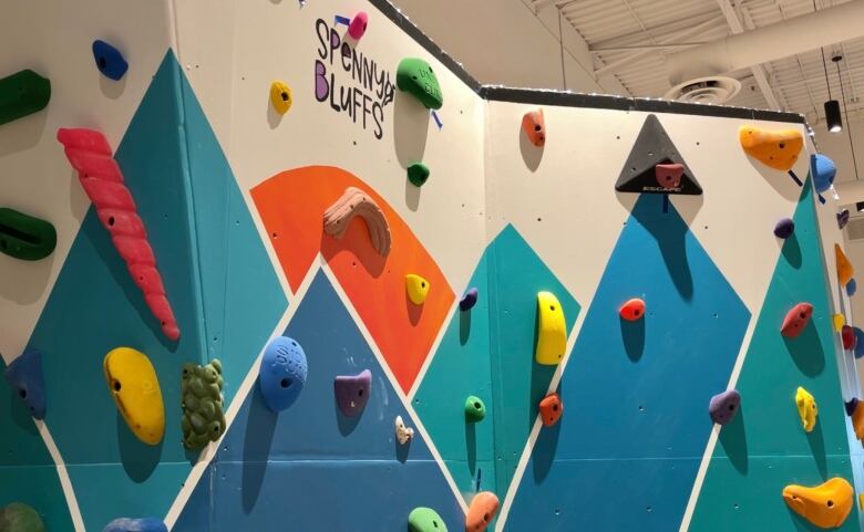 An image shows the colourful new climbing wall with different coloured hand and foot holds.