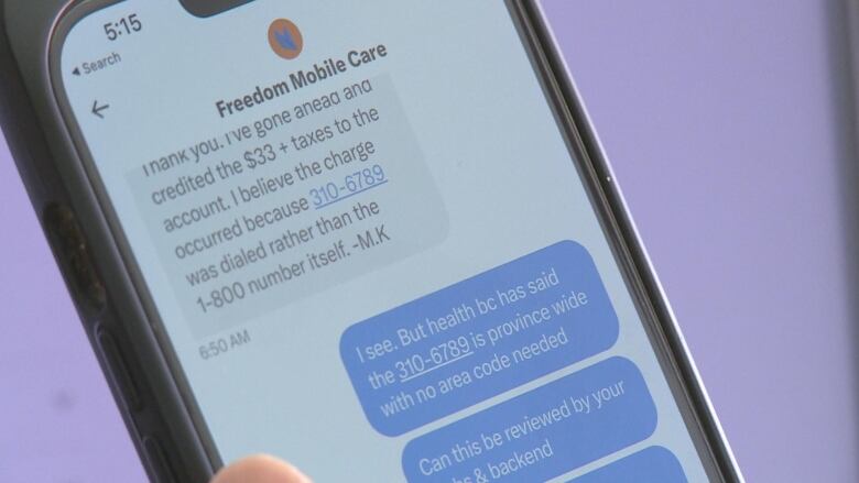 A cell phone shows a text conversation with a Freedom Mobile representative. 