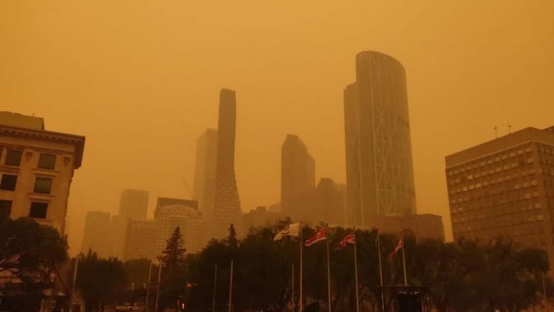 An orange haze sits over Calgary on Tuesday, May 16, 2023, as wildfire smoke descends on southern Alberta. 