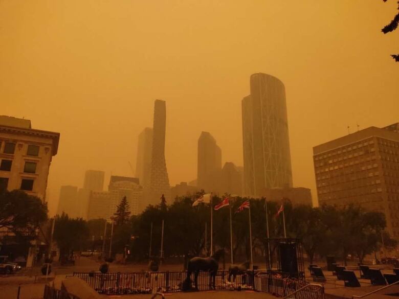 An orange haze sits over Calgary on Tuesday, May 16, 2023, as wildfire smoke descends on southern Alberta. 