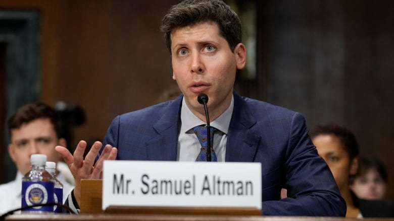 A man speaks into a microphone.