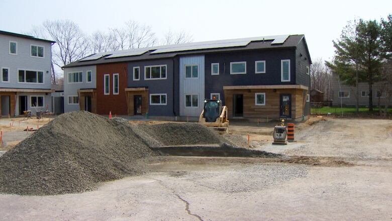 A row of townhouses is seen under construction. 