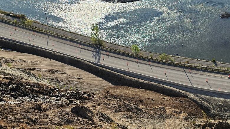 The photo shows a hill, a road and the Yukon River. 