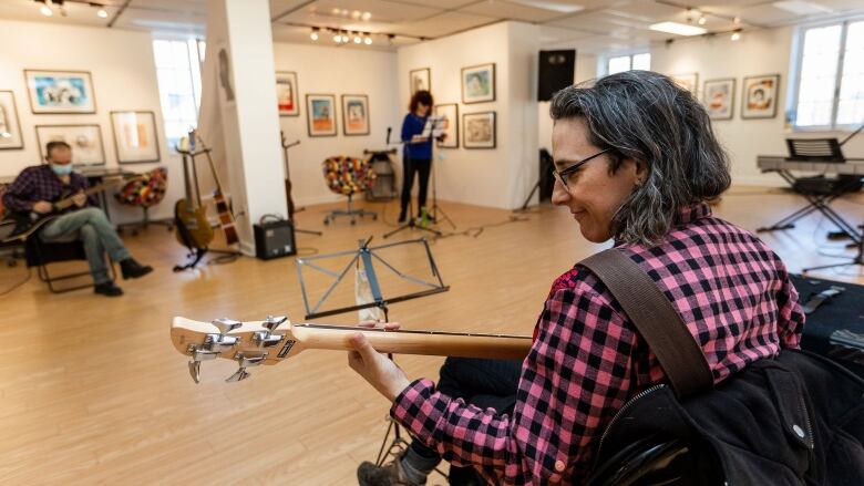 People are playing music in a room.