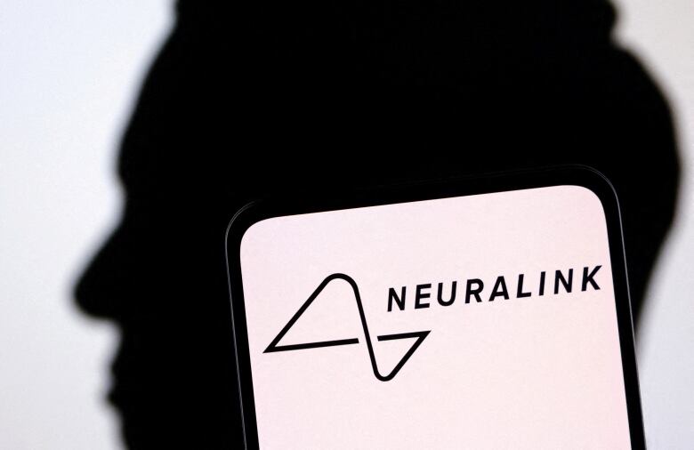 A photo illustration of Elon Musk's silhouette is shown behind the Neuralink logo.