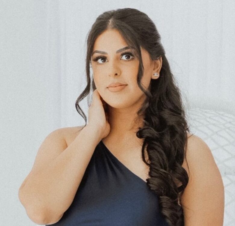 An Indian woman poses for a headshot.