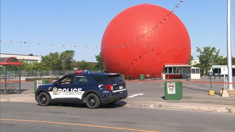 A police car is parked on the side of the road.