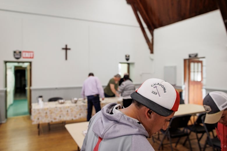 Migrant farm workers drop by for a weekly gathering at a local Anglican church in Simcoe, Ont.