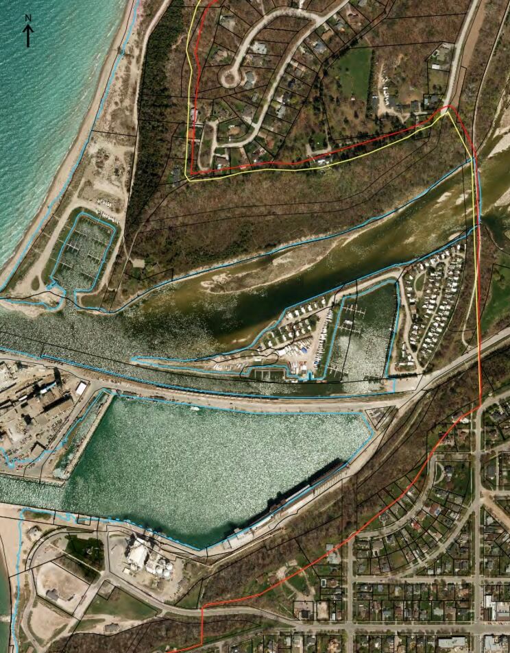 Aerial shot of Goderich marina with a thin red line to the right of it. 