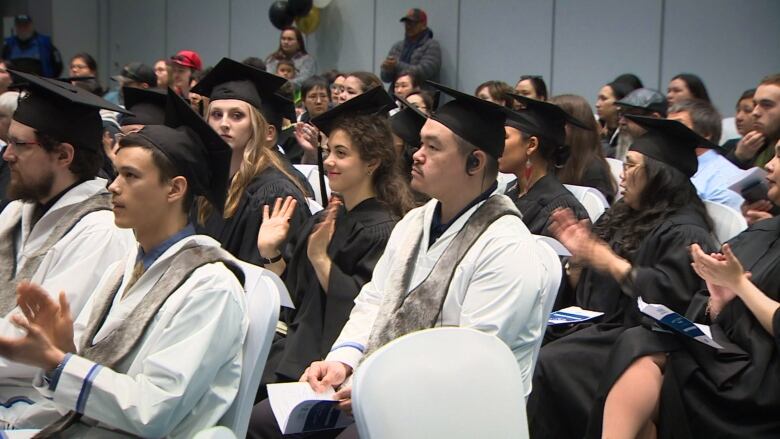 students in graduation hats and gowns