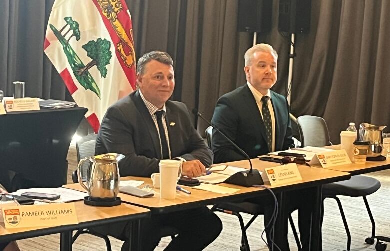 Premier Dennis King and deputy minister Christopher Gillis at the Council of Atlantic Premiers in Mill River, P.E.I., on Monday.