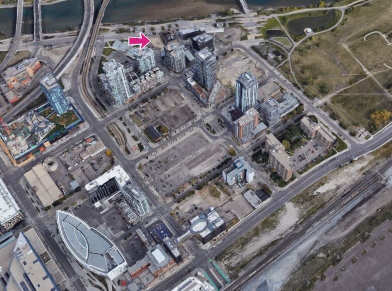 An aerial view of an urban area in Calgary next to a river.