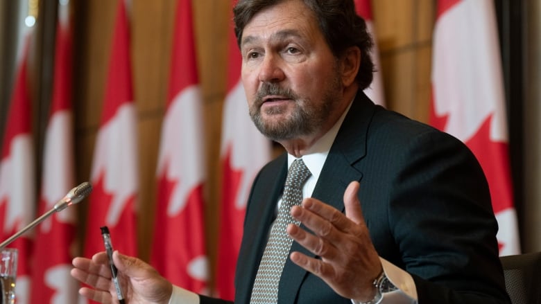 Supreme Court of Canada Chief Justice Richard Wagner gestures as he responds to a reporters question.