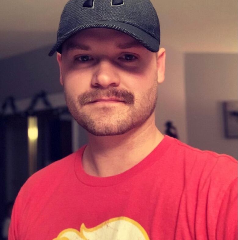 A photo of Joss Engen, wearing a Calgary Flames T-shirt.