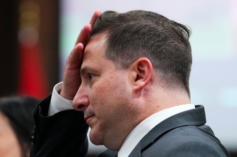 Public Safety Marco Mendicino wipes his brow after an appearance at a Commons committee meeting.