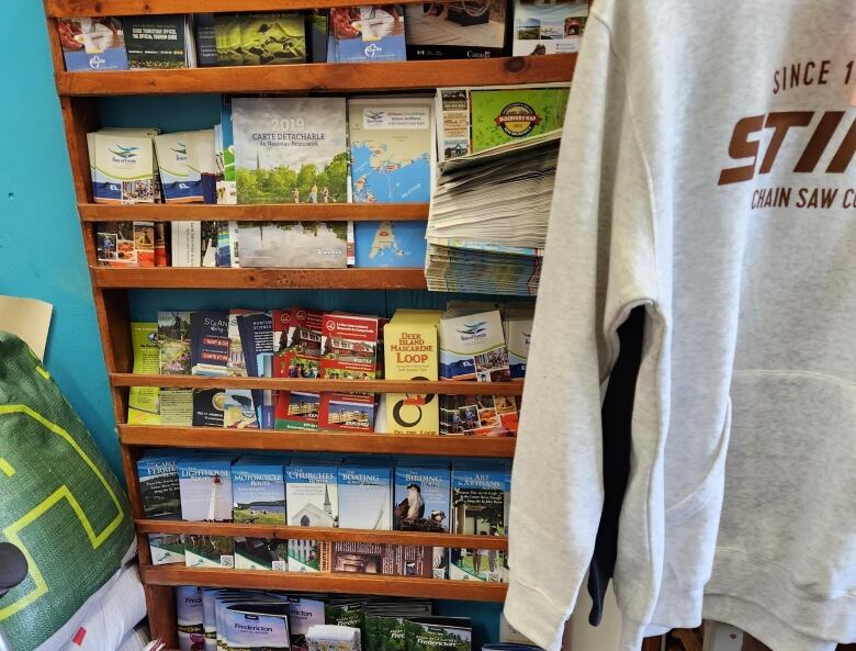 A shelf full of colourful maps inside a buisness