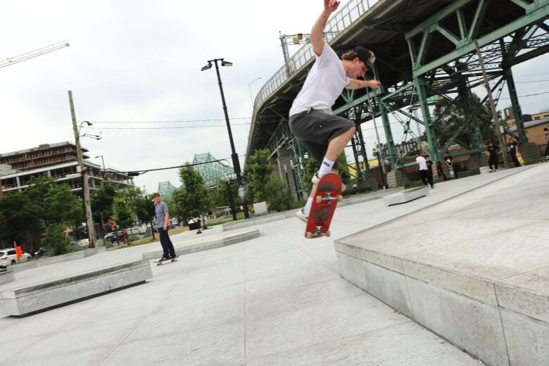 man does skateboard trick