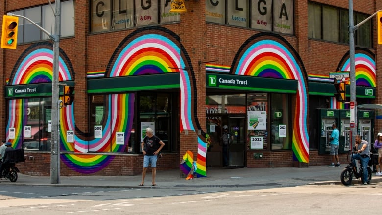 The TD bank is decorated with the colours of the Progress Pride flag.