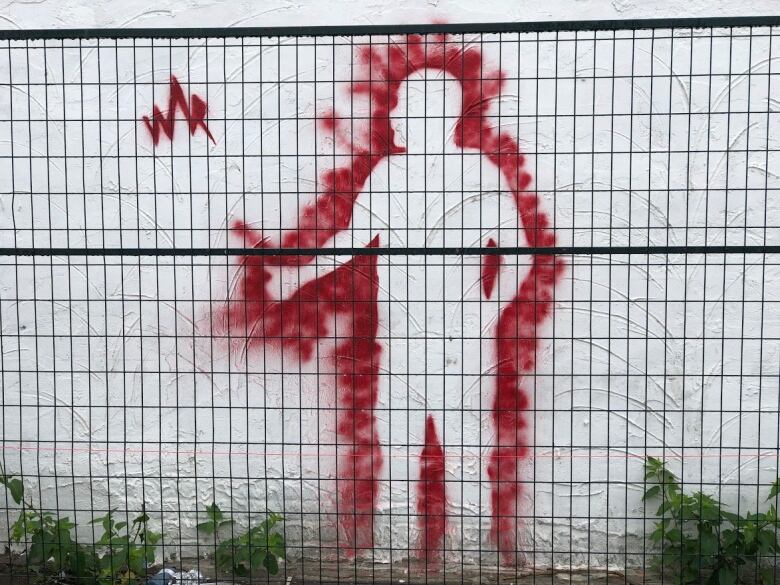 Graffiti, featuring a silhouette with a thumbs up, has been popping up around Windsor  from Sandwich to Riverside. 