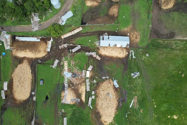 Bird's eye view of damage to a farm property after a tornado.