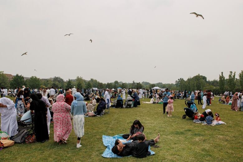 People at a park celebrating Eid al-Adha in Toronto.