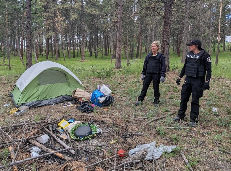 Pictured are City of Cranbrook staff visiting a homeless camp in city limits.